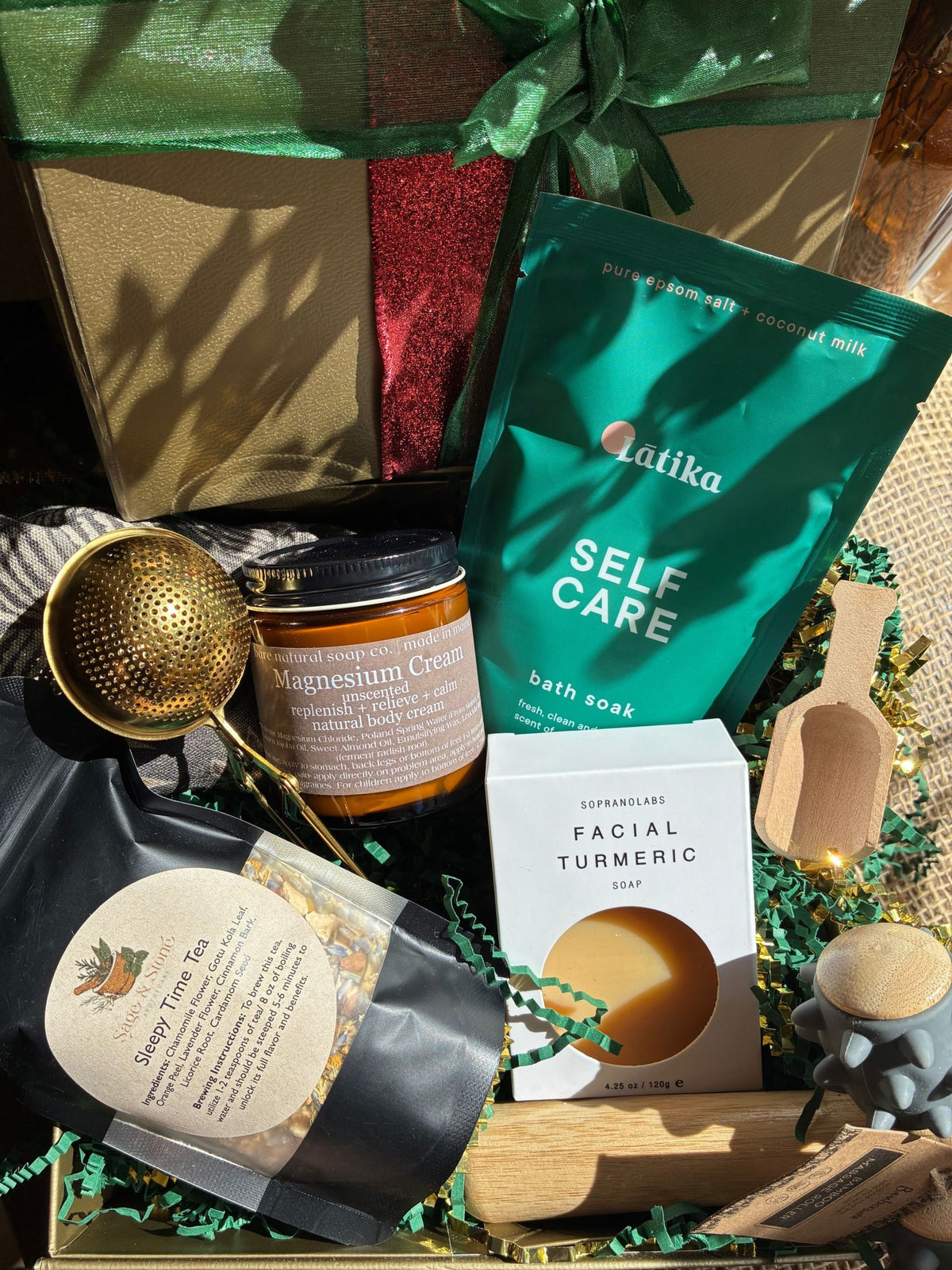 Self Care Gift Box for the holidays with gift wrapping, natural bath soak, facial tumeric soap, lotion, tea and massage roller