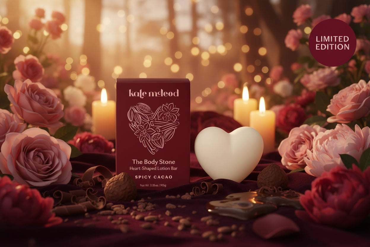 Heart-shaped lotion bar with packaging labeled 'kate mcLeod' on a pink background