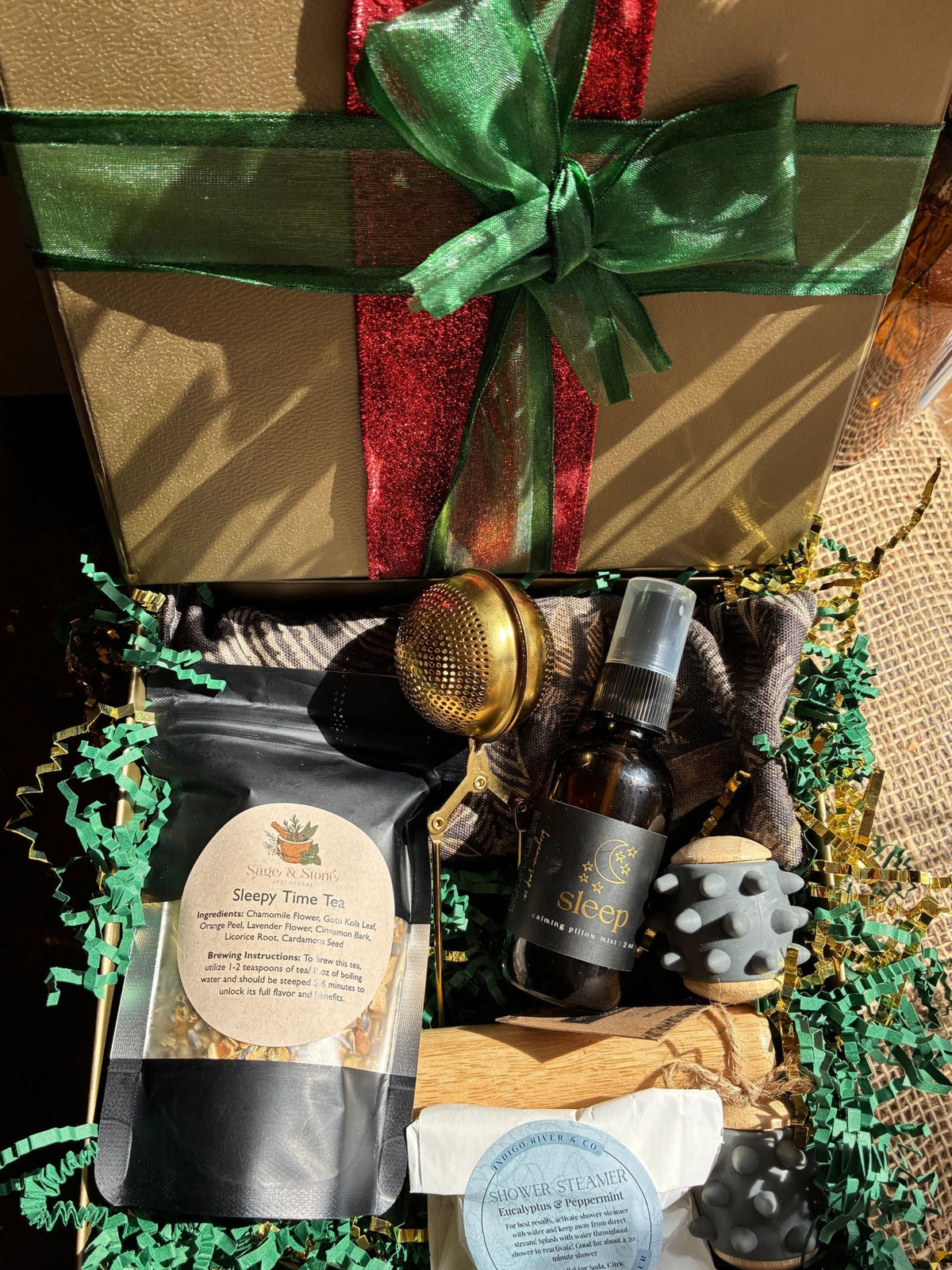 Self Care Gift Box with pillow spray, massage roller, sleep tea and shower steamer in a decorated box