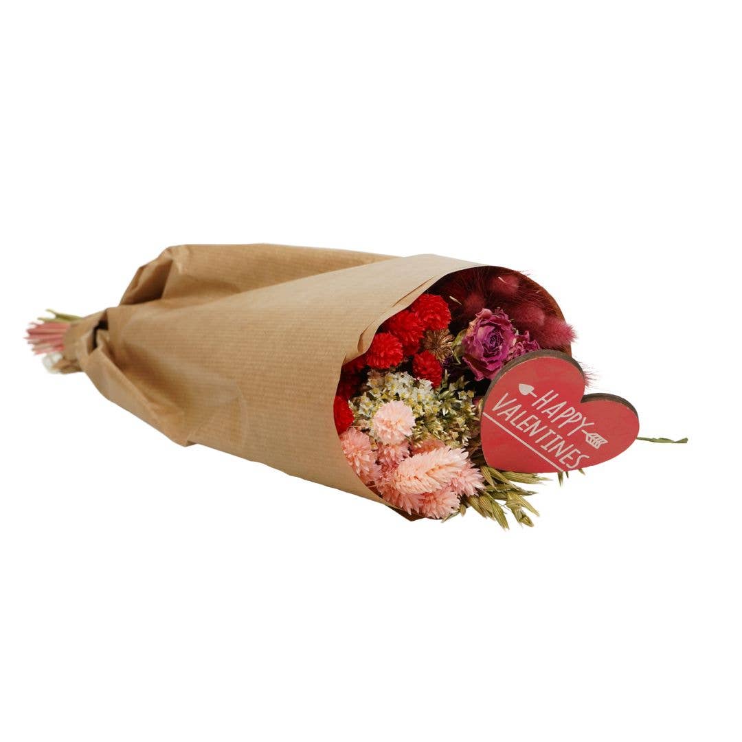 Bouquet of flowers wrapped in brown paper with a 'Happy Valentine's' heart tag on a white background
