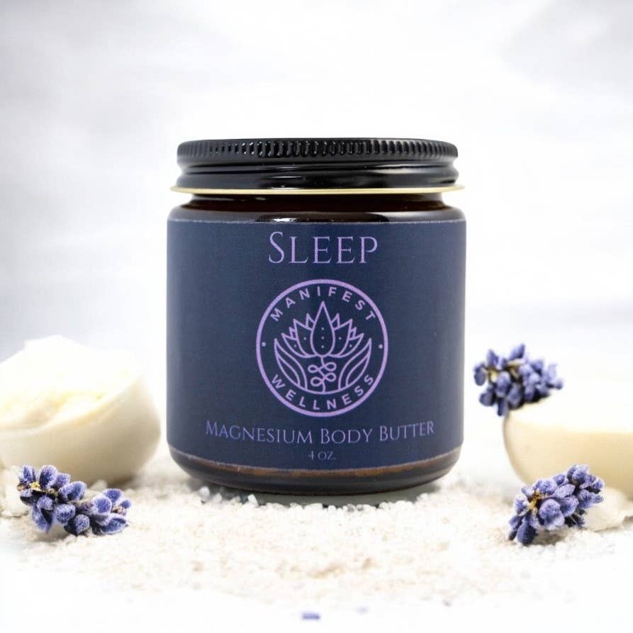Jar of Sleep magnesium body butter from Manifest Wellness with lavender flowers on a white background
